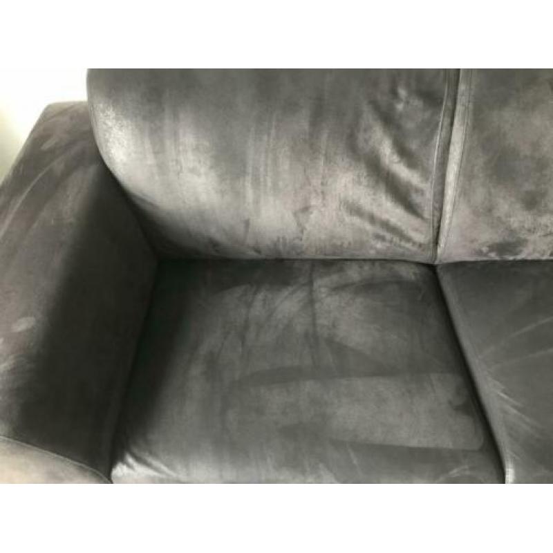 Zwarte hoekbank en fauteuil