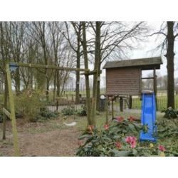 Speelhuisje glijbaan schommel ringen